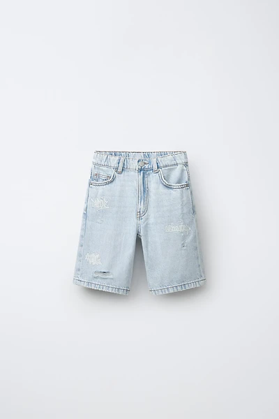 RIPPED AND GRAFFITI DENIM SHORTS