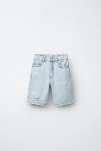 RIPPED AND GRAFFITI DENIM SHORTS