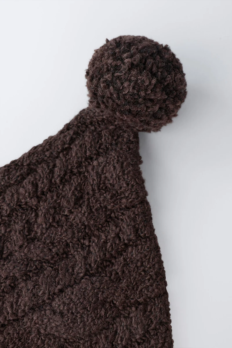 CABLE KNIT POMPOM BONNET