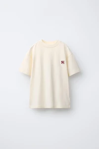 T-SHIRT UNI PIÈCE APPLIQUÉE