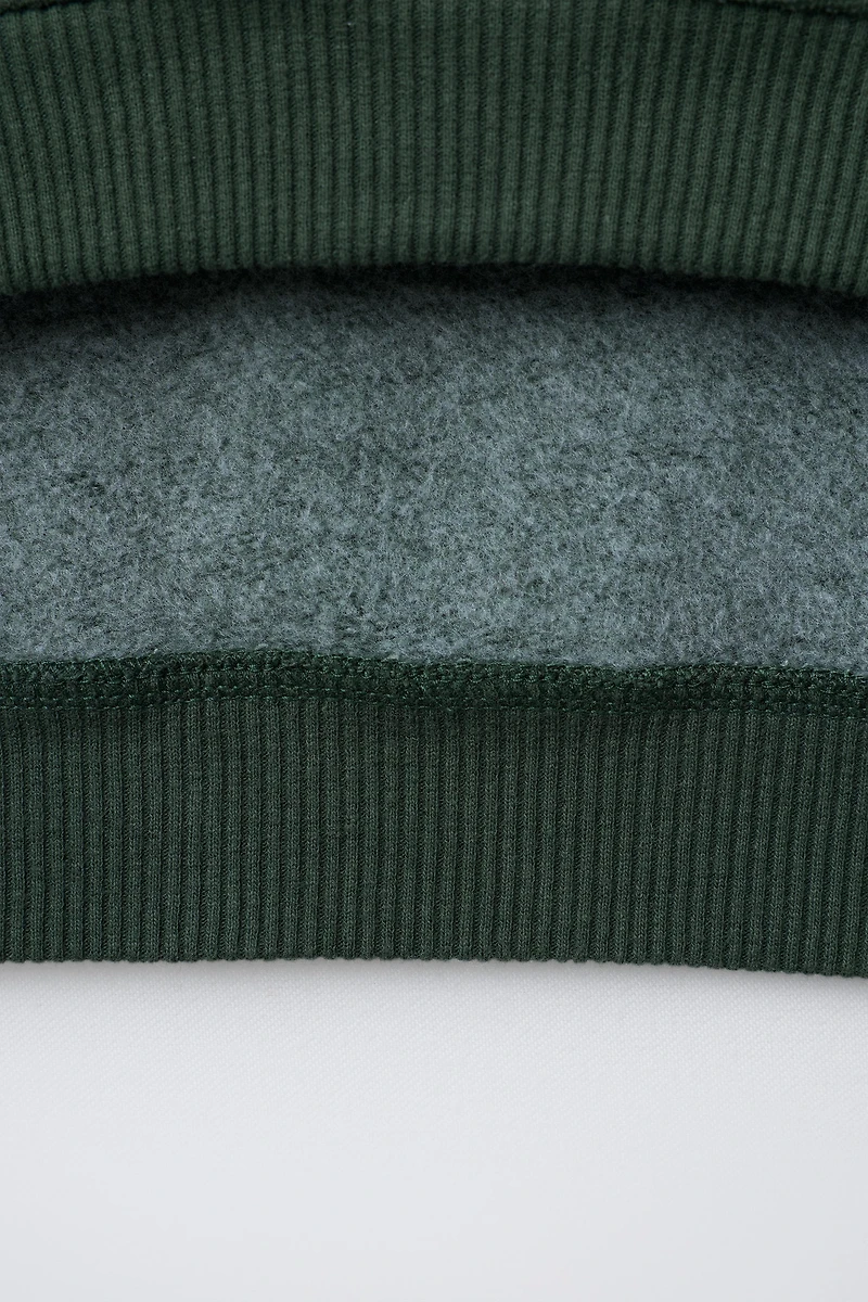 FAUX SHEARLING BEAR PATCH SWEATSHIRT