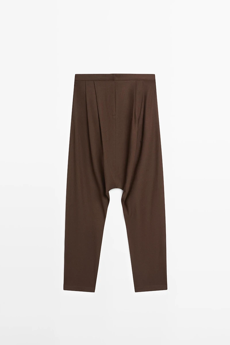 Baggy trousers with pleated details