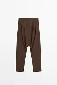 Baggy trousers with pleated details