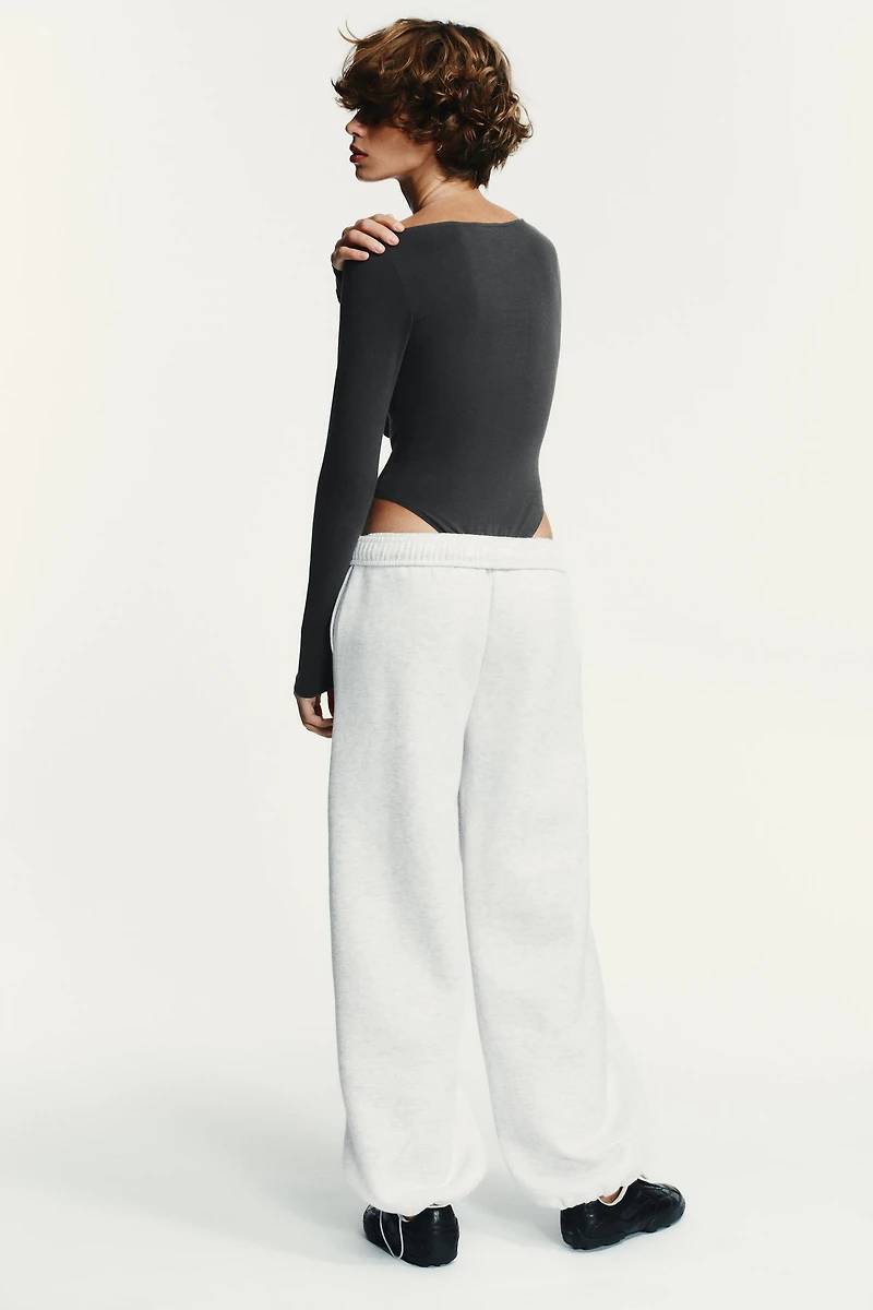 ASYMMETRIC LONG SLEEVE BODYSUIT