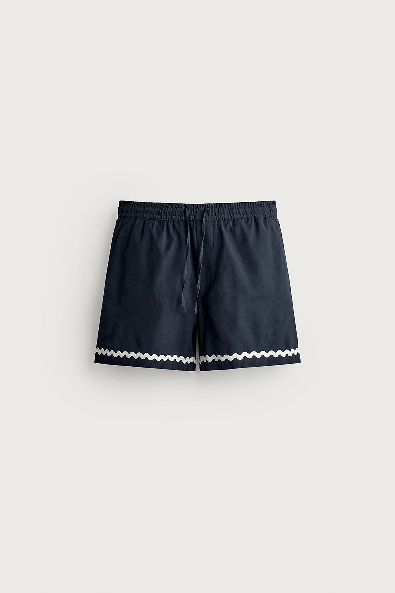 SHORT COURT BRODERIE POISSON
