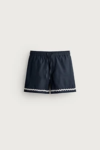 SHORT COURT BRODERIE POISSON