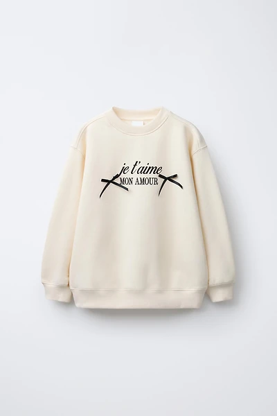 TEXT AND BOW PRINT SWEATSHIRT