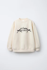 TEXT AND BOW PRINT SWEATSHIRT