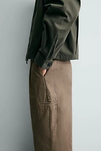 PLEATED BAGGY FIT CHINO PANTS