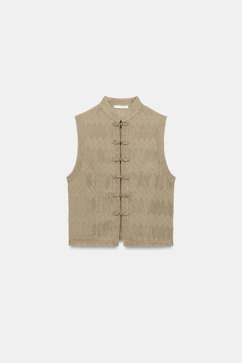 PLEATED VEST WITH FROG FASTENING