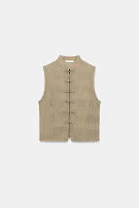 PLEATED VEST WITH FROG FASTENING