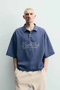 EMBROIDERED TEXT BOXY FIT POLO SHIRT