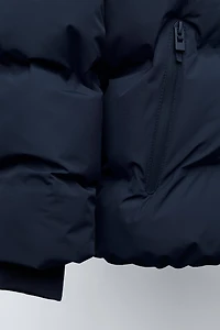 MANTEAU REMBOURRÉ ÉTIQUETTE DÉPERLANT