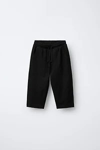 TEXTURED PANTS WITH LABEL