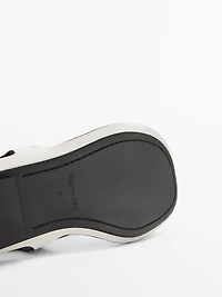 Flat leather sandals with buckles