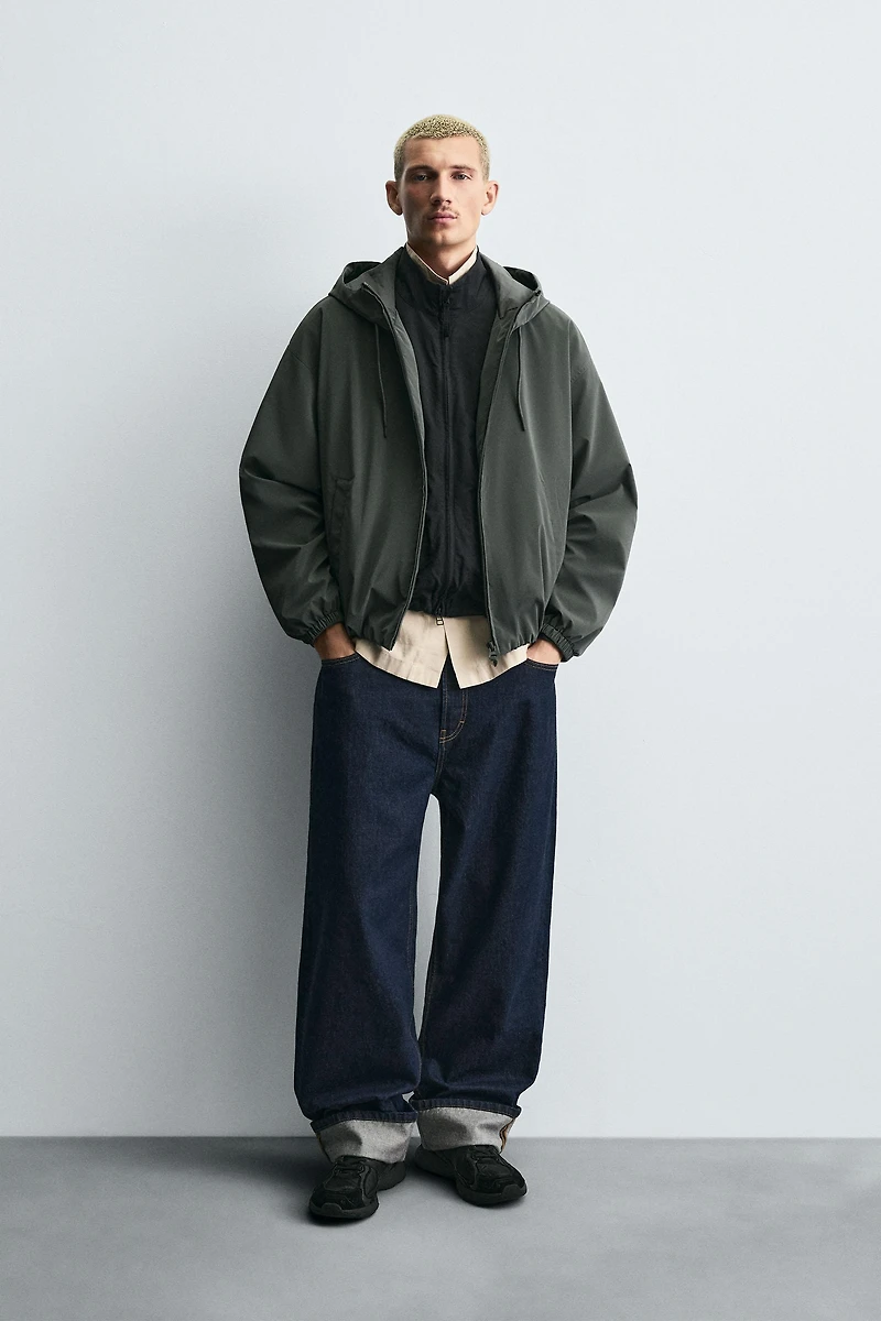 VESTE TECHNIQUE À CAPUCHE