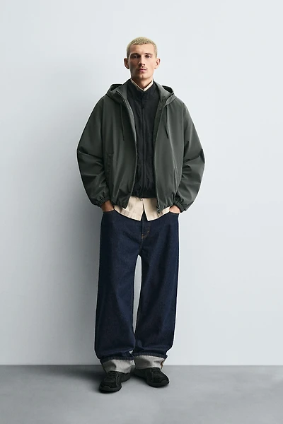 VESTE TECHNIQUE À CAPUCHE