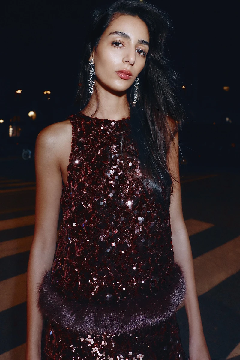 SEQUIN TOP WITH FAUX FUR HEM