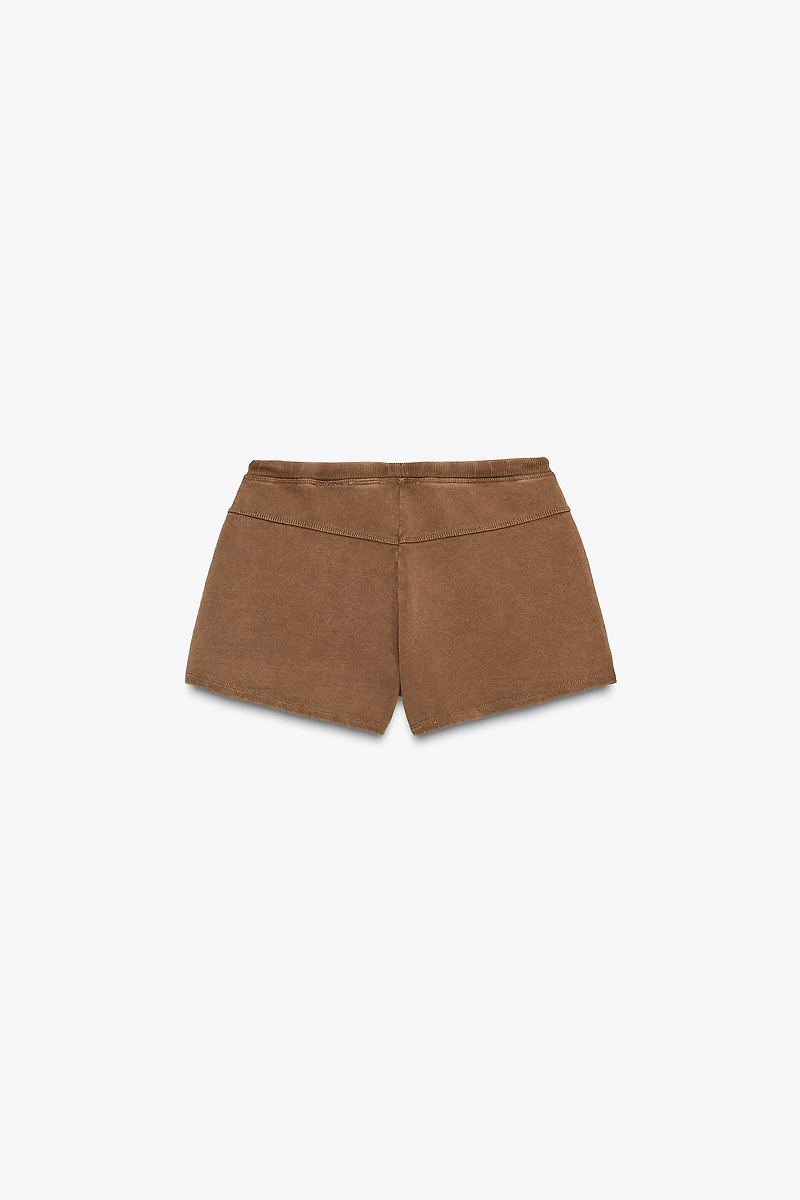 WASHED EFFECT STUDDED SHORTS