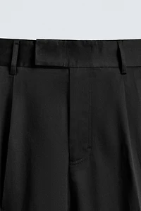 RELAXED FIT PLEATED PANTS