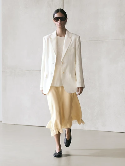 Asymmetric skirt with lace-trimmed detail