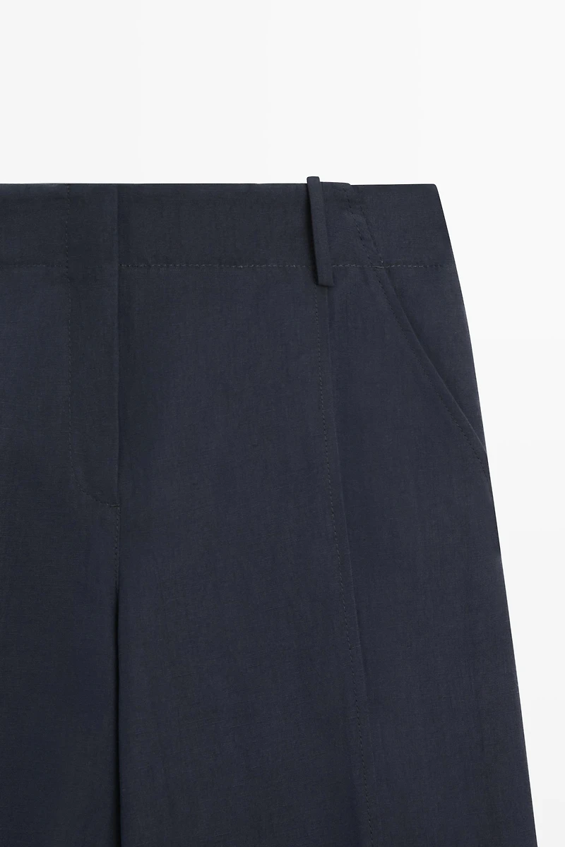 Flowing linen blend pants with buttoned tab detail