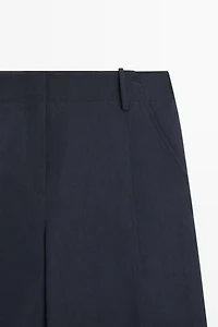 Flowing linen blend pants with buttoned tab detail