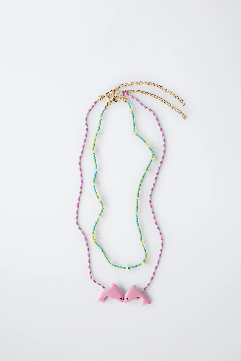 PACK OF TWO BEADED DOLPHIN NECKLACES