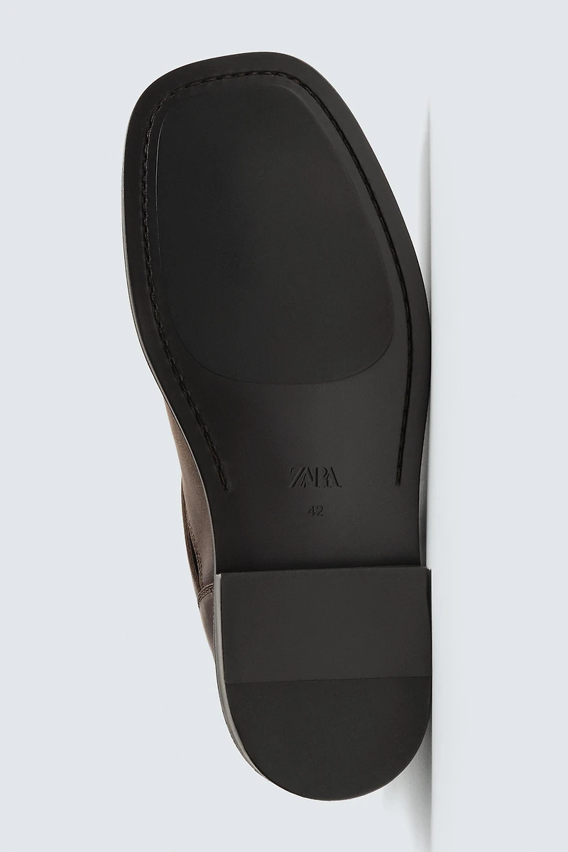 LIMITED EDITION BUCKLED LEATHER BOOTS