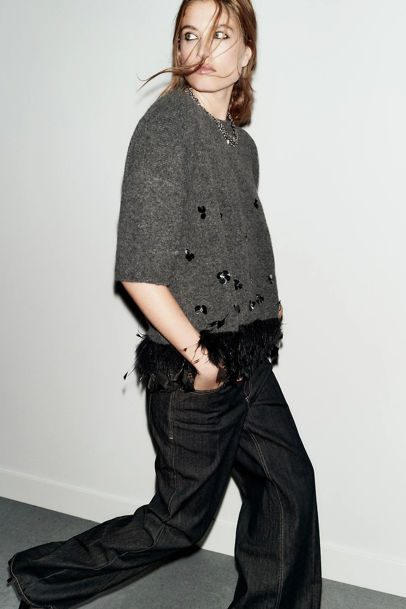 WOOL SWEATER WITH SEQUINS AND FEATHERS