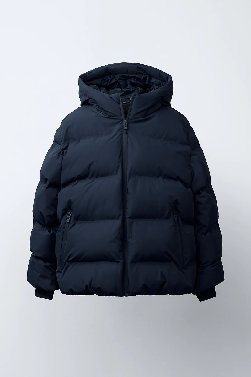 MANTEAU REMBOURRÉ ÉTIQUETTE DÉPERLANT