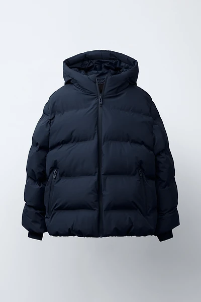MANTEAU MATELASSÉ ÉTIQUETTE DÉPERLANT