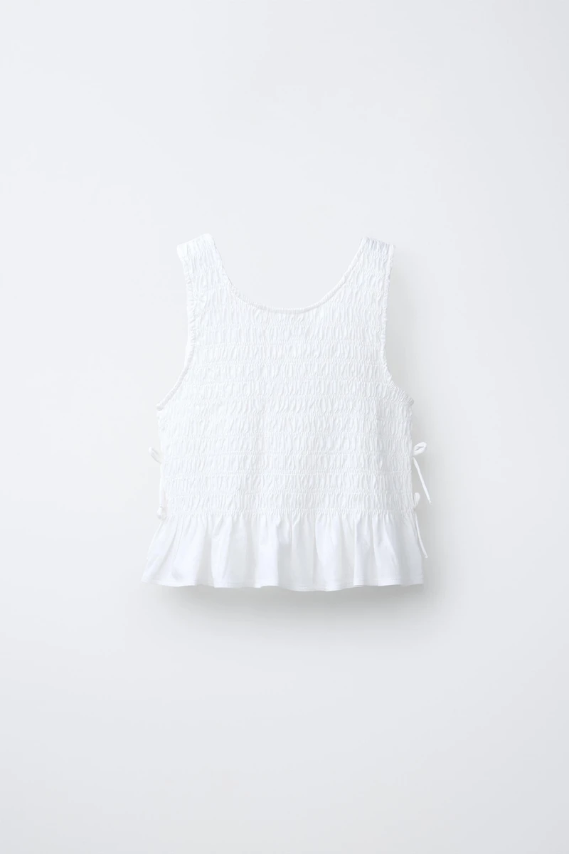 ELASTICIZED TIE TOP