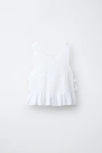 ELASTICIZED TIE TOP