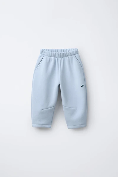 FLEECE LINED BAGGY PANTS WITH LOGO