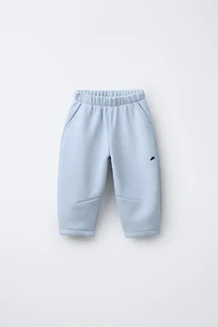 FLEECE LINED BAGGY PANTS WITH LOGO