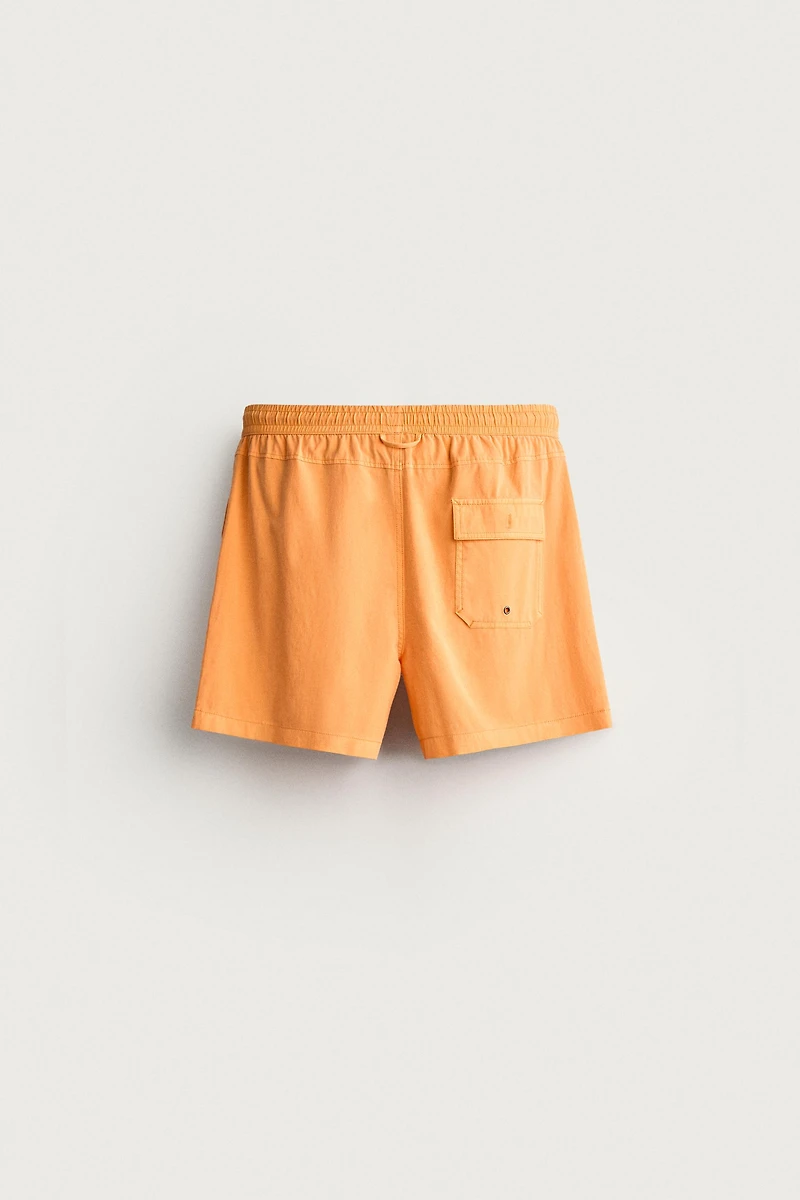 WASHED EFFECT LONG SWIM TRUNKS