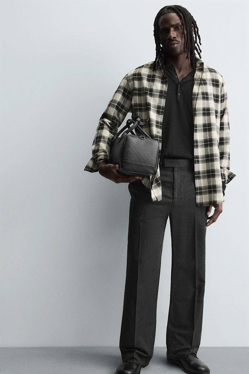 TEXTURED RUBBERIZED CROSSBODY BAG