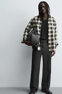 TEXTURED RUBBERIZED CROSSBODY BAG