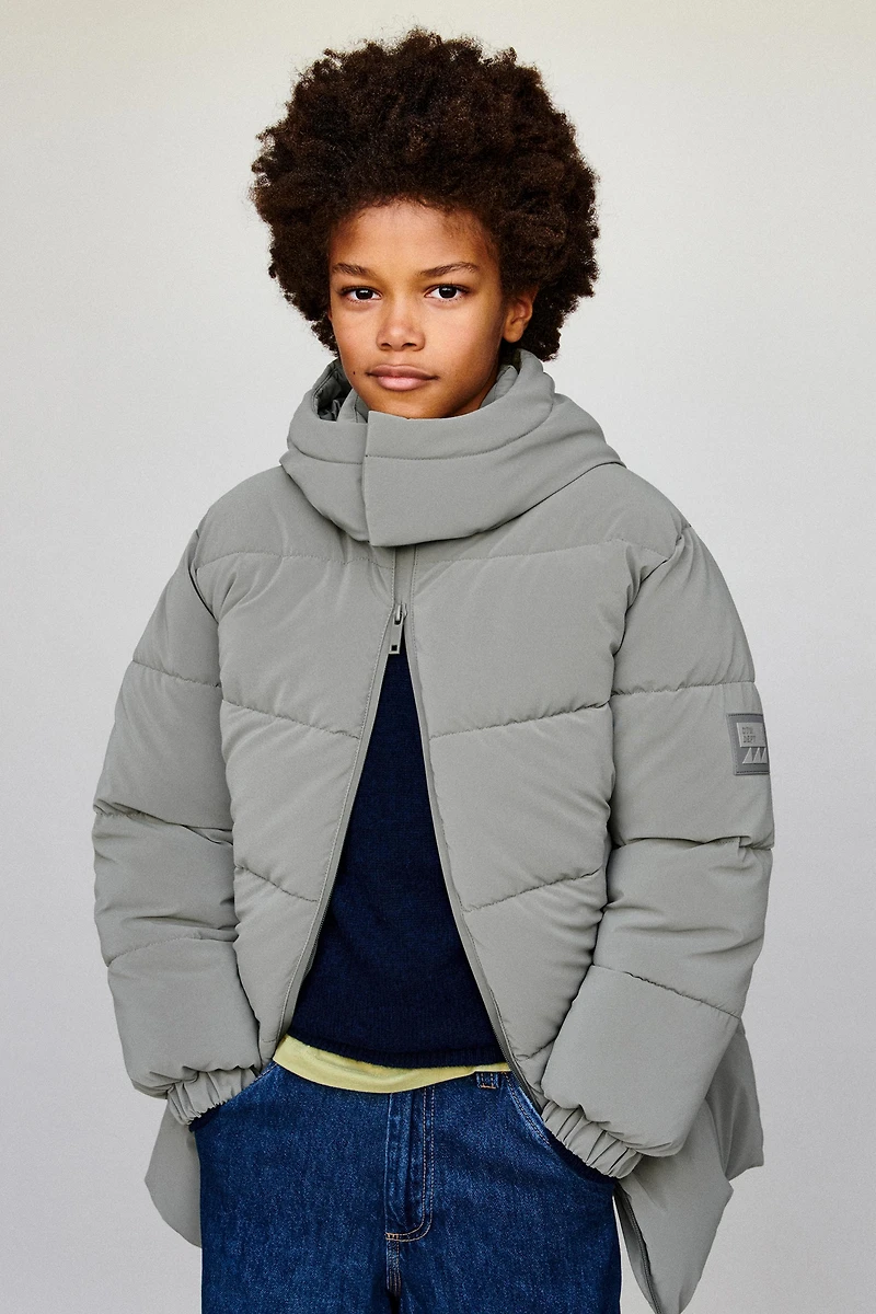 MANTEAU LONG À ÉTIQUETTE GOMMÉE