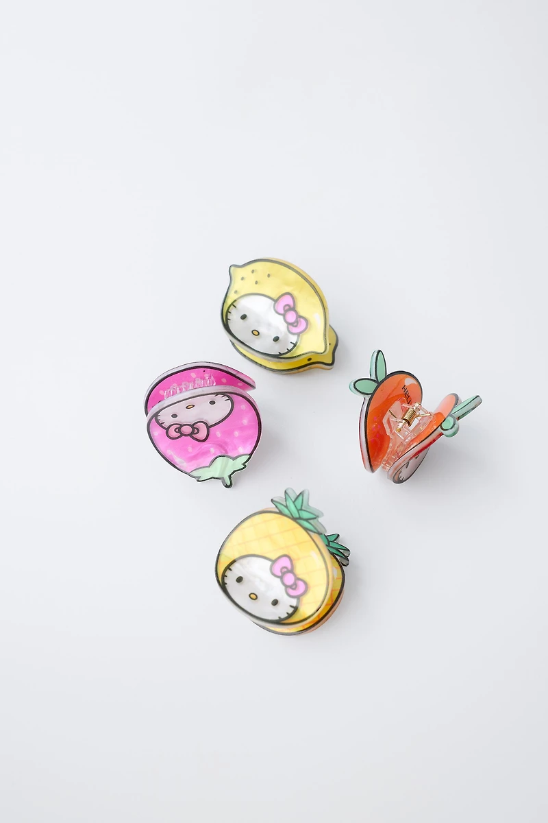LOT DE QUATRE PINCES FRUITS HELLO KITTY © SANRIO