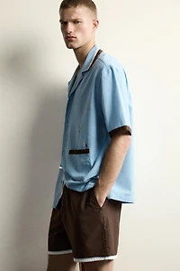 SWIMMER EMBROIDERY RELAXED FIT SHIRT