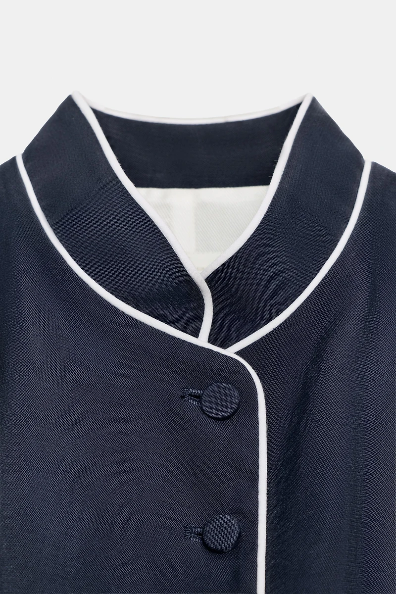 GILET À LISERÉS EN CONTRASTE