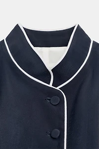GILET À LISERÉS EN CONTRASTE
