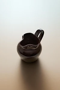 RAISED DESIGN STONEWARE JUG