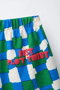 CLARA CEBRIAN © PLAID SHORTS