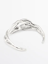 Bracelet métallique abstrait