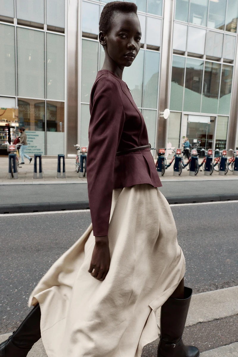 VESTE PEPLUM EFFET DAIM CEINTURÉE