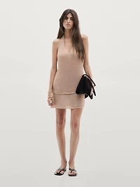 Top en maille brillante à encolure américaine