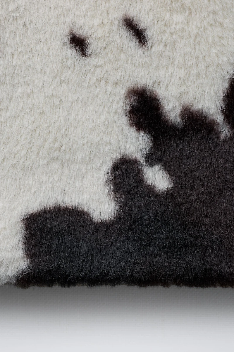 BLOUSON EFFET FOURRURE IMPRIMÉ VACHE